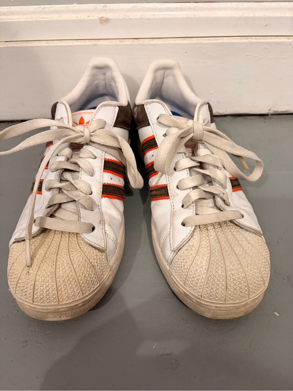 Adidas White Shell Toe Sneakers with Brown and Orange Stripes